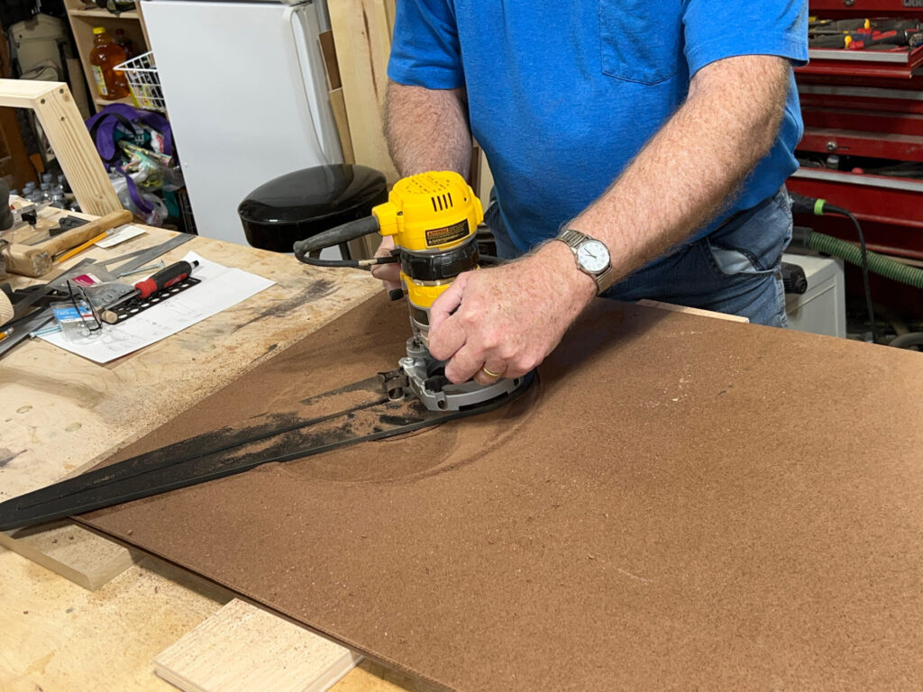 Use a router trammel to cut the hole